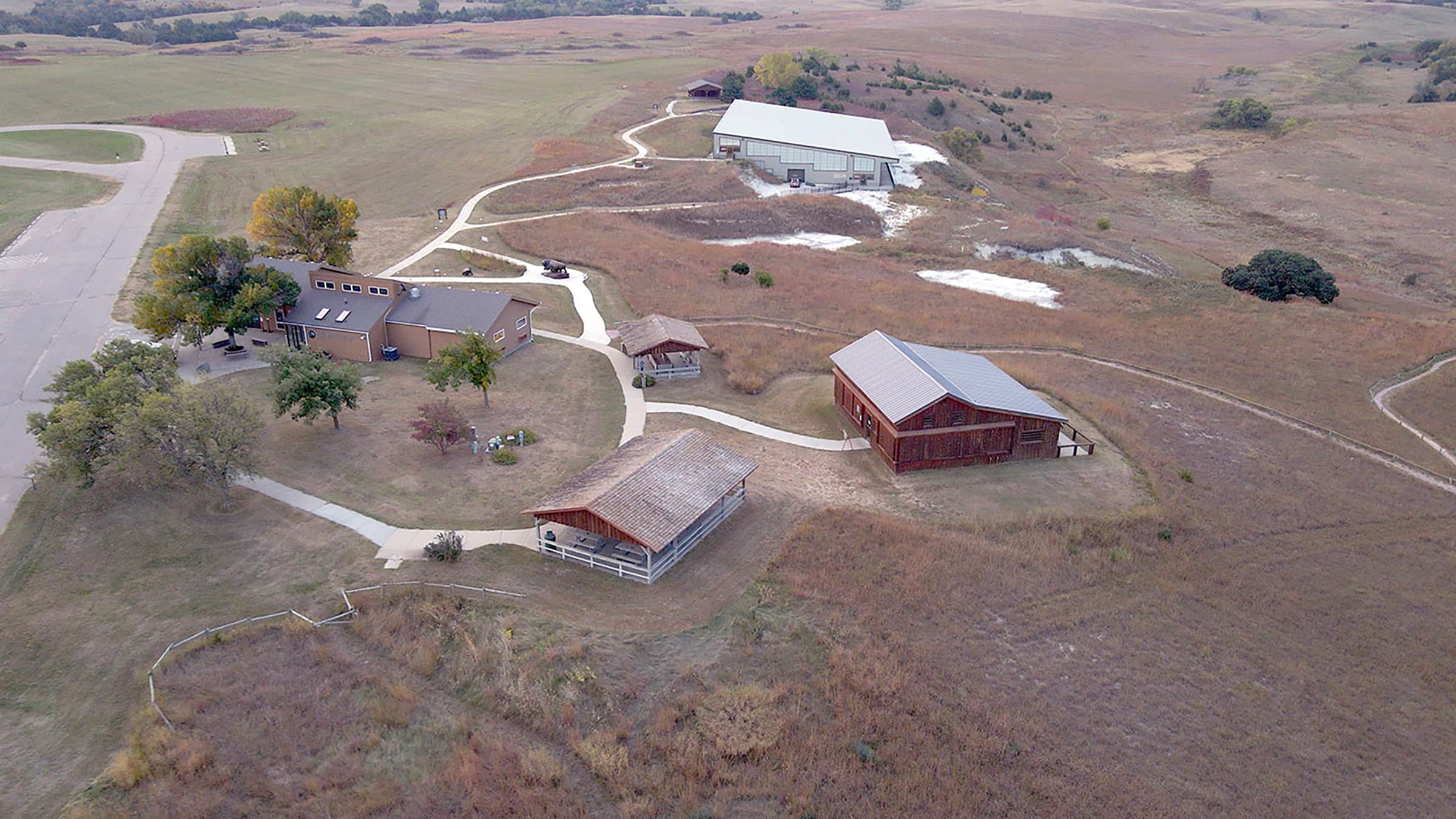 Drone sky view of Ashfall Fossil Beds trails and buildings. 