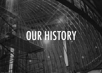 Black and white architecture with text "Our History"