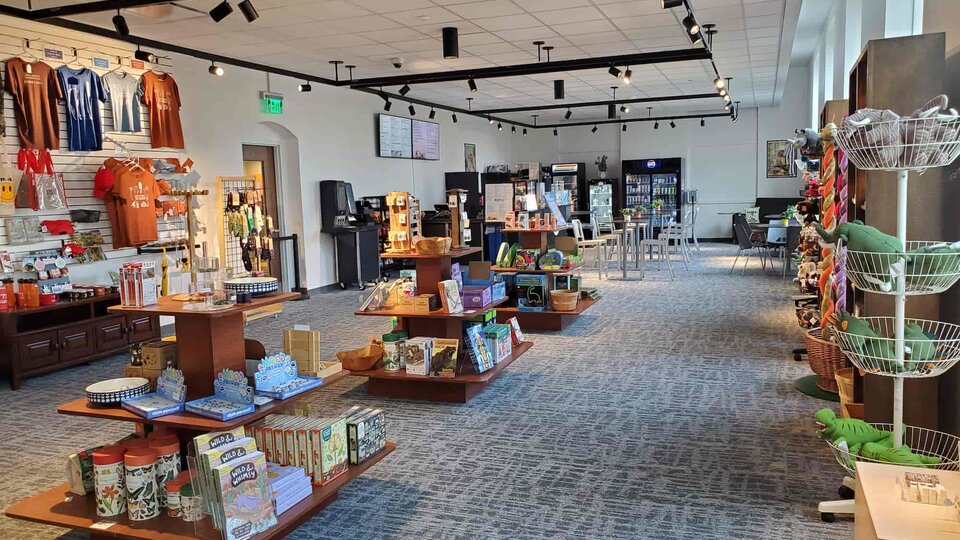 Inside of Discovery Gift Shop and stands and shelves of merchandise